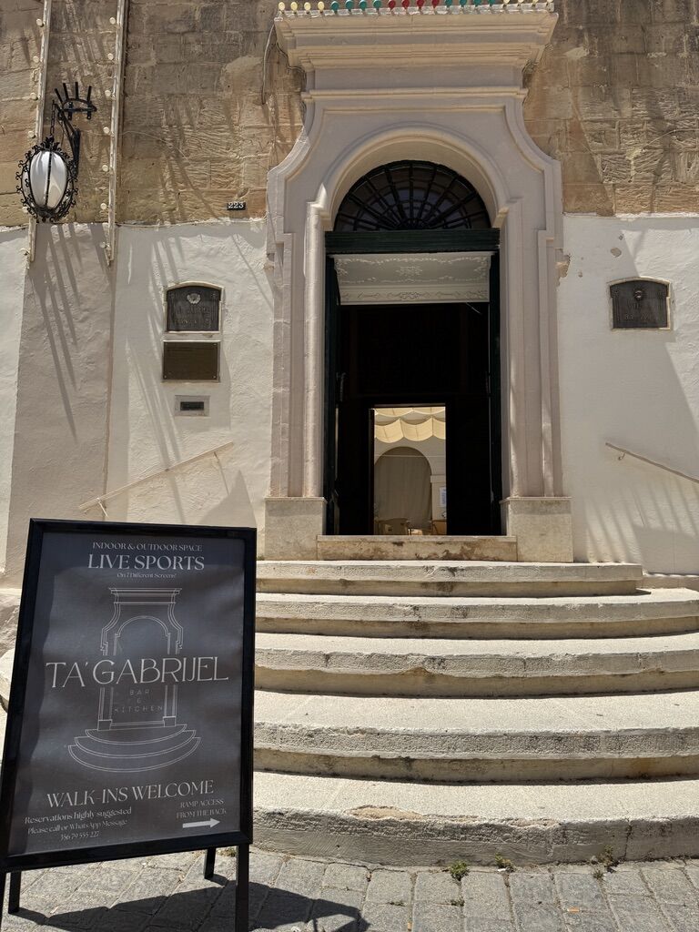 The arched entrance at 223 Main Street, Balzan, with our Live Sports sign